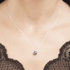 18 carat White Gold pendant with one blue round London topaz
