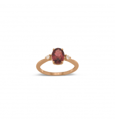 18 carat rose gold ring with oval rhodolite and 2 diamonds